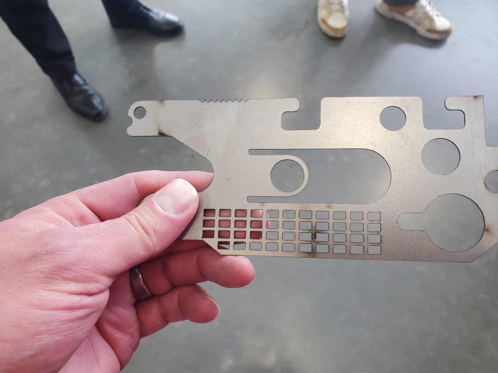 Laser-cut part held up on the SMF shop floor